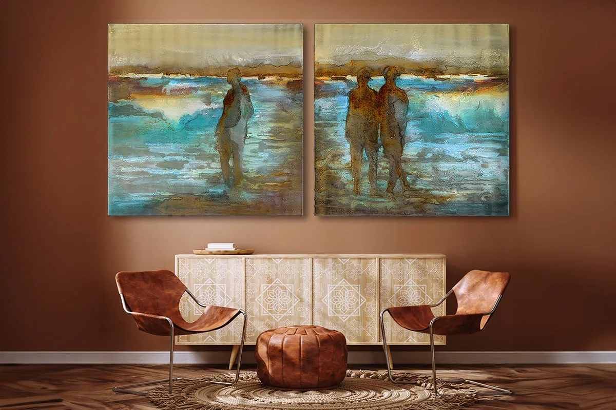 Two-panel abstract coastal artwork featuring human silhouettes in reflective water, displayed above a carved wood sideboard in a warm, earthy-toned living space with leather chairs and bohemian decor.